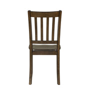 Front facing chair-only back view of five-piece traditional walnut wooden dining set with a table and four chairs on a white background