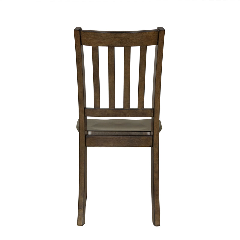 Front facing chair-only back view of five-piece traditional walnut wooden dining set with a table and four chairs on a white background