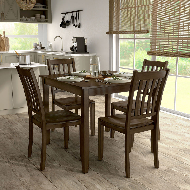 Side facing five-piece traditional walnut wooden dining set with a table and four chairs in a room with accessories
