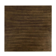 Front-facing top view of the tabletop featured in a five-piece traditional walnut wooden dining set with a table and four chairs on a white background