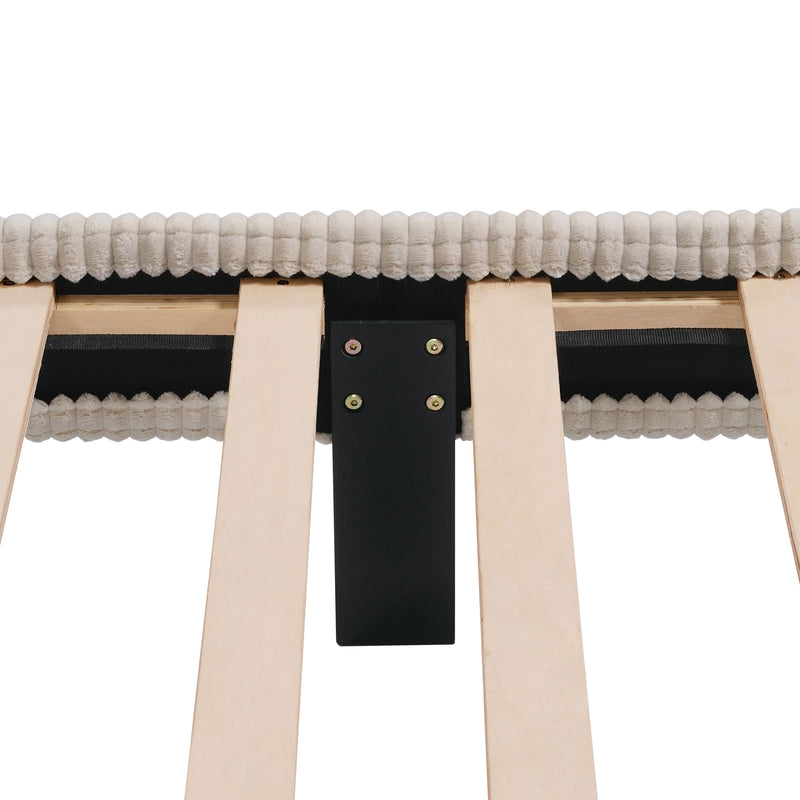 Front facing close up view of the interior support leg of a modern ivory corduroy channel tufted headboard queen platform bed on a white background