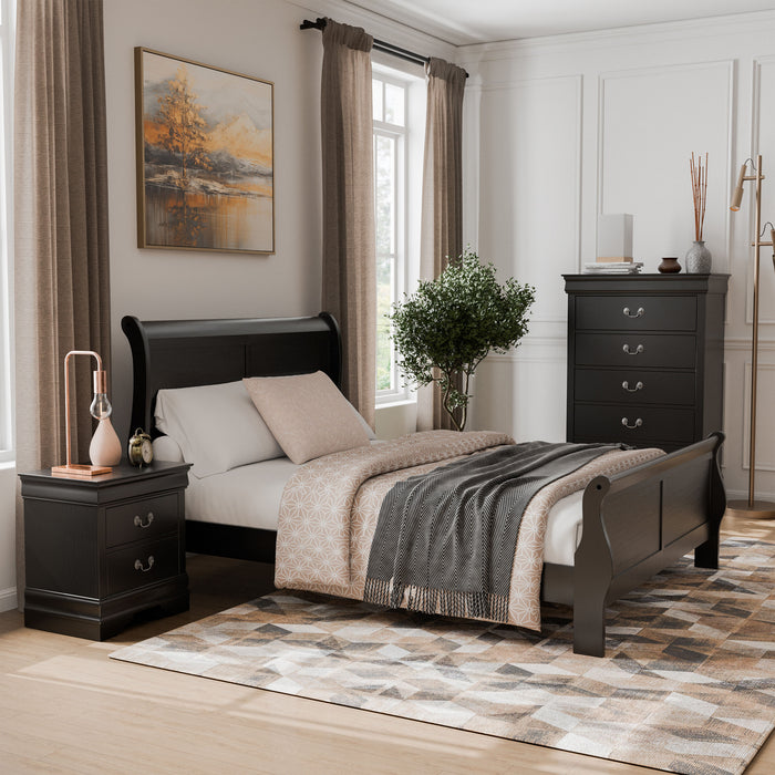 Right facing three-piece traditional black finish solid wood queen bedroom set with (1) queen sleigh bed, (1) two-drawer nightstand, and (1) five-drawer chest in a room with linens and accessories