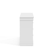 Front facing side view of a traditional white finish solid wood six-drawer dresser on a white background