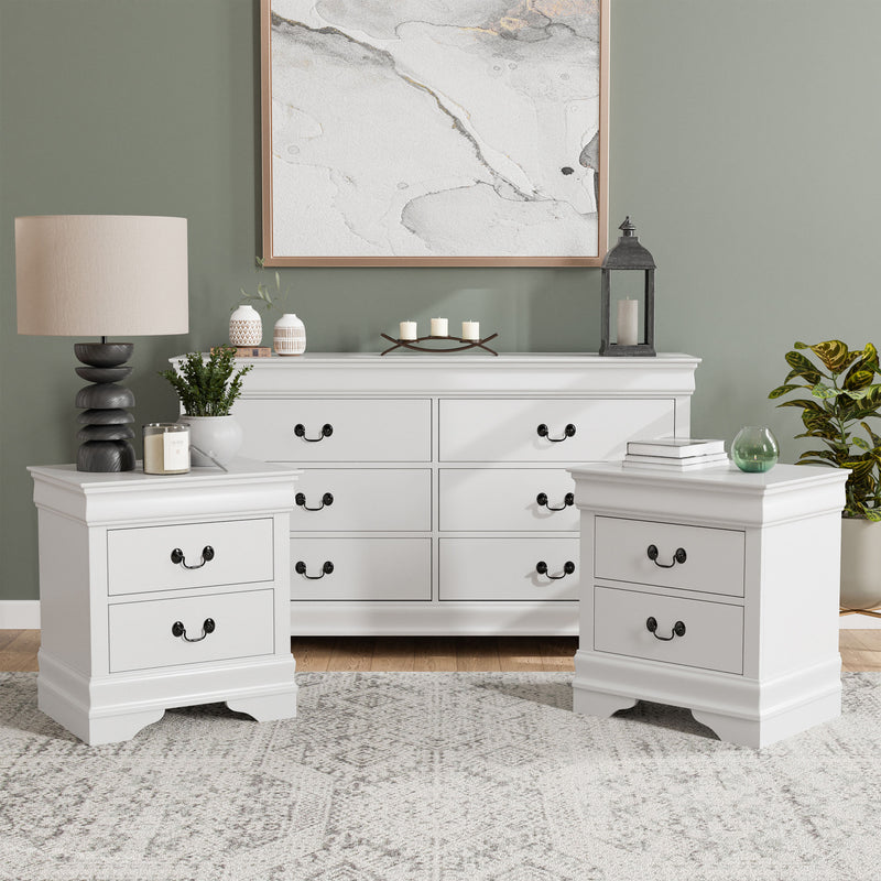 Three-piece traditional white finish bedroom set that includes (1) five-drawer chest and (2) two-drawer nightstands in a room with accessories