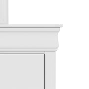 Front facing close up of a traditional white finish solid wood six-drawer dresser showing its molded trim, on a white background