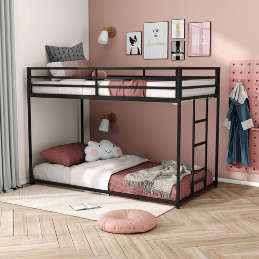 Left facing contemporary black metal twin-over-twin bunk bed in a bedroom with accessories