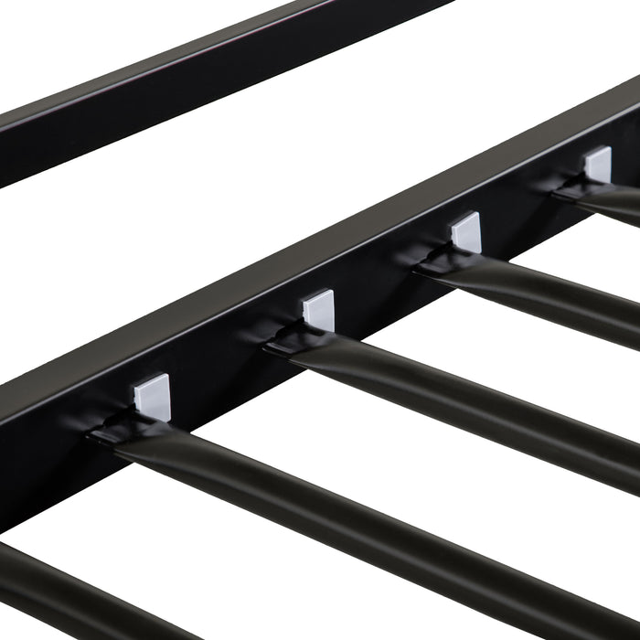 Close up view of the slats of a contemporary black metal twin-over-full bunk bed on a white background