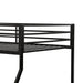 Close up view of the guardrail of a contemporary black metal twin-over-full bunk bed on a white background