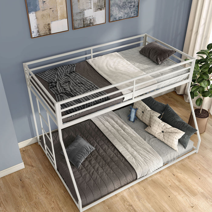 Right facing bird's eye view of a contemporary white metal twin-over-full bunk bed in a bedroom with accessories