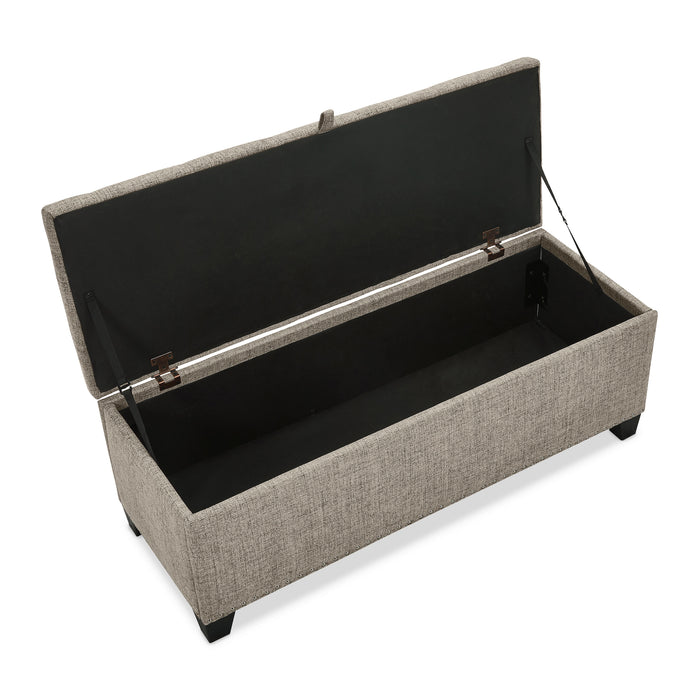 Right facing bird's eye view of a modern light brown upholstered storage bench with a lift top opened on a white background