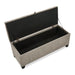 Right facing bird's eye view of a modern light brown upholstered storage bench with a lift top opened on a white background