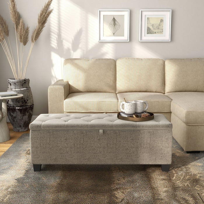 Front facing modern light brown upholstered storage bench with a lift top in a room with accessories