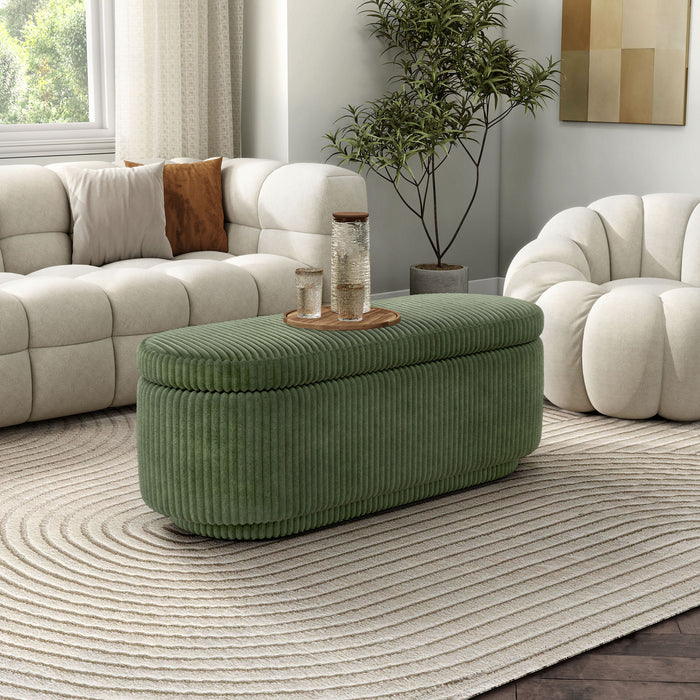 Right facing modern tufted green chenille oval storage bench in a room with accessories