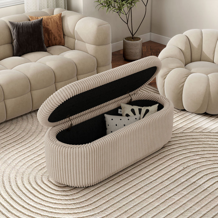 Right facing modern tufted beige pink chenille oval storage bench with top lifted in a room with accessories