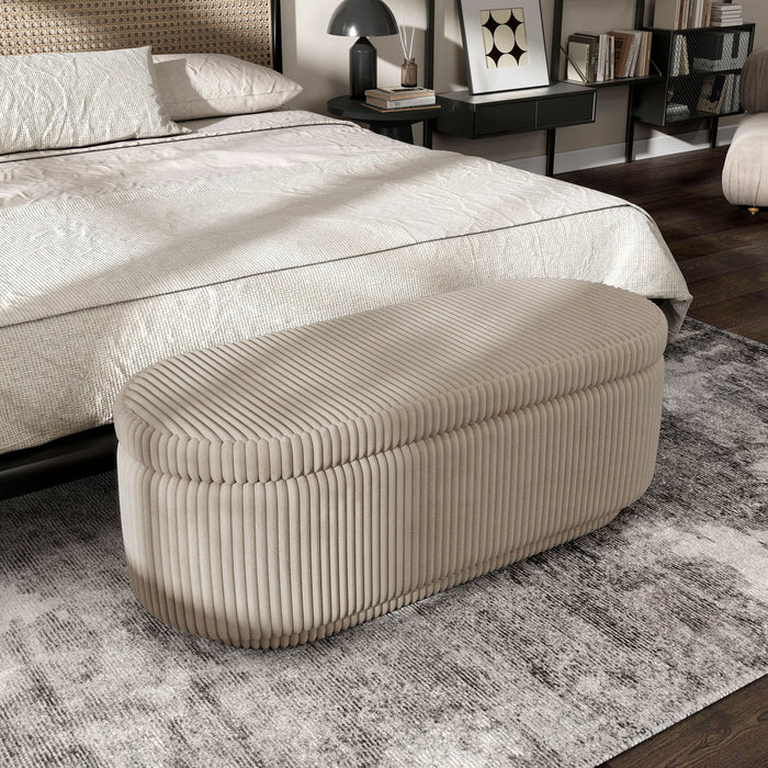 Right facing modern tufted beige pink chenille oval storage bench in a room with accessories