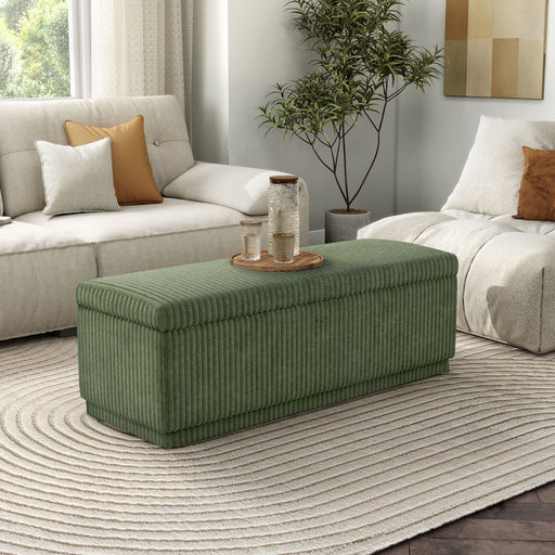 Right facing modern tufted green chenille rectangular storage bench in a room with accessories