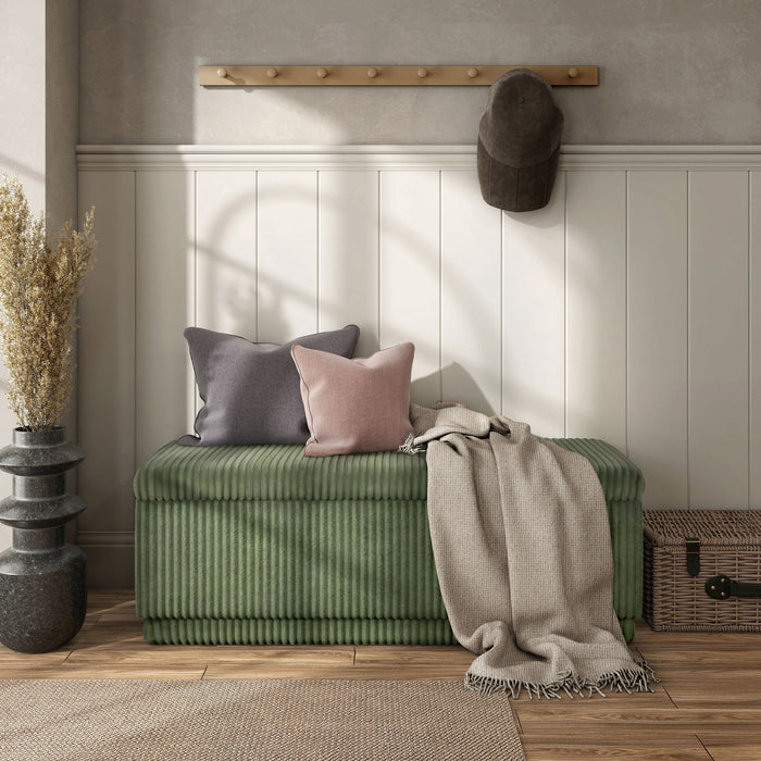 Front facing modern tufted green chenille rectangular storage bench in a room with accessories