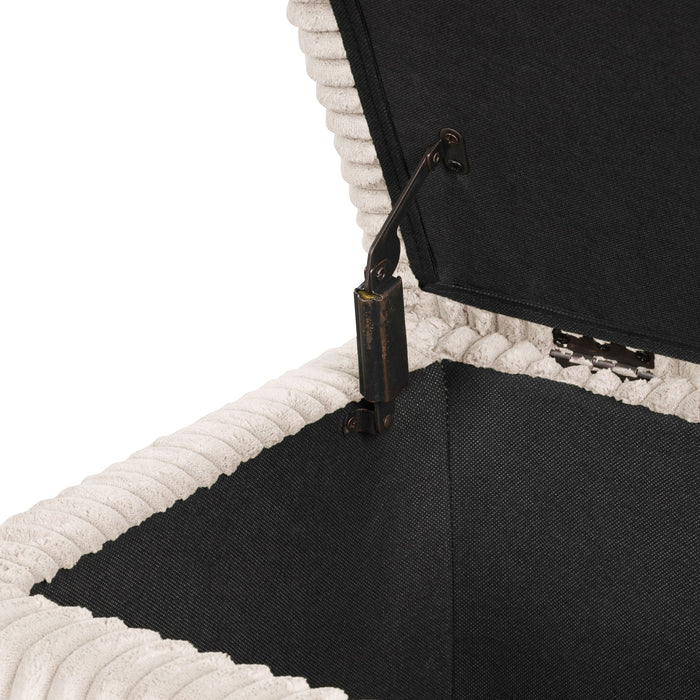 Left facing close up of the open top and hinge of a modern tufted beige pink chenille rectangular storage bench on a white background