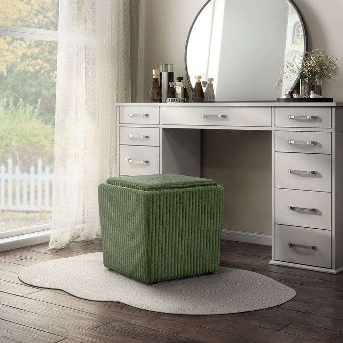 Left facing modern tufted green chenille storage ottoman with a reversible tray top in a room with accessories