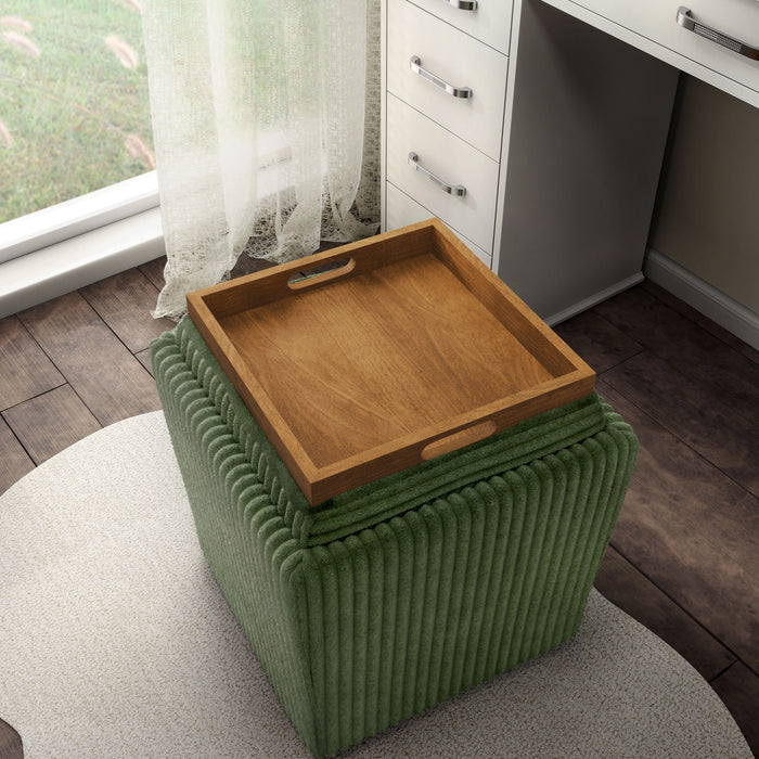 Left facing bird's eye view of a modern tufted green chenille storage ottoman with a reversible tray top in a room with accessories