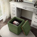 Left facing bird's eye view of a modern tufted green chenille storage ottoman with a reversible tray top in a room with accessories