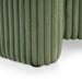 Left facing close up of a modern tufted green chenille round storage ottoman with a flip top on a white background