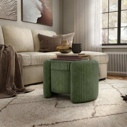 Right facing modern tufted green chenille round storage ottoman with a flip top in a room with accessories