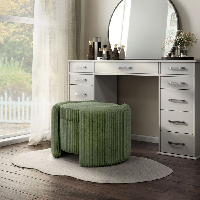 Left facing modern tufted green chenille round storage ottoman with a flip top in a room with accessories