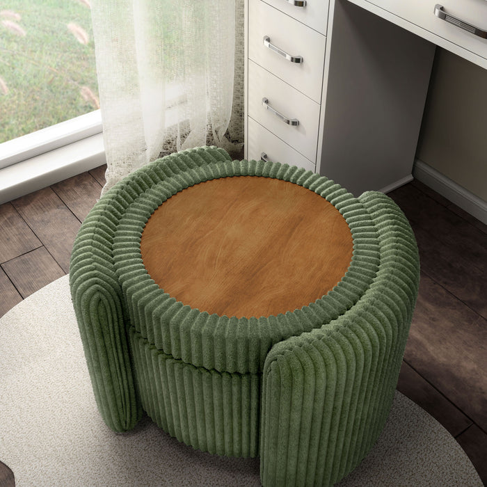 Left facing bird's eye view of a modern tufted green chenille round storage ottoman with a flip top in a room with accessories