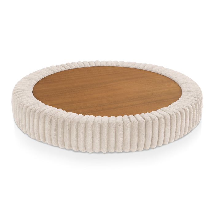Top only view of a modern tufted beige pink chenille round storage ottoman with a flip top on a white background