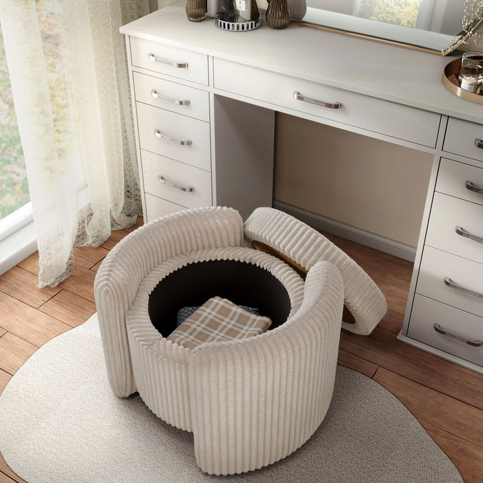 Left facing bird's eye view of a modern tufted beige pink chenille round storage ottoman with a flip top removed in a room with accessories