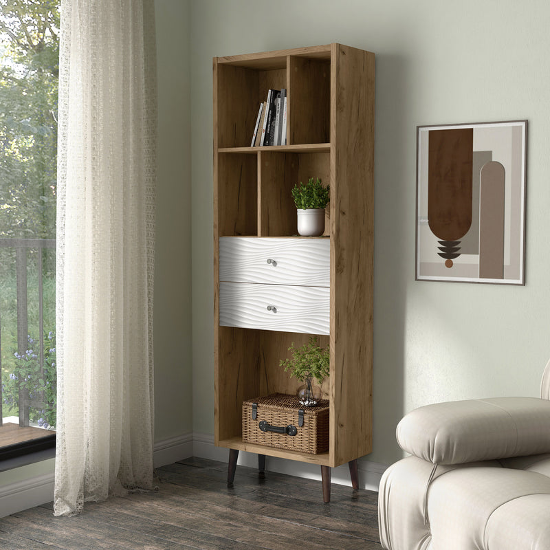 Left facing mid-century modern light oak two-drawer tall bookcase in a room with accessories