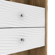 Right facing close up of the drawers of a mid-century modern light oak two-drawer tall bookcase on a white background