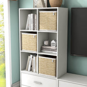 Left facing durable modern six-cubby white storage bookcase as part of a larger modular configuration in a room with accessories