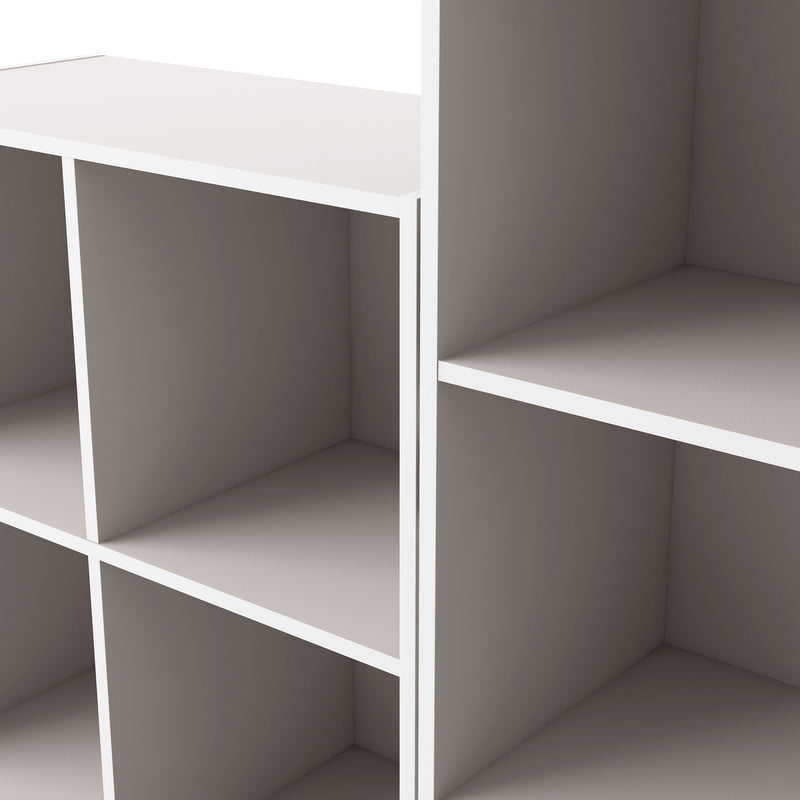 Left facing close up view of a durable modern three-shelf taupe grey storage bookcase in a larger modular configuration on a white background