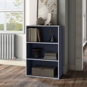 Left facing durable modern three-shelf steel blue storage bookcase in a larger modular configuration in a room with accessories