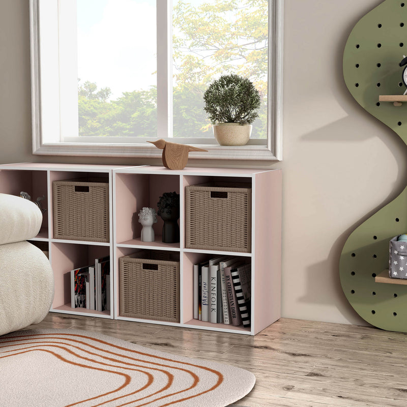 Right facing durable modern four-cubby light pink storage bookcase as part of a larger modular configuration in a room with accessories