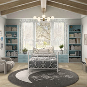 Front facing durable modern three-shelf light blue storage bookcase in a larger modular configuration in a room with accessories