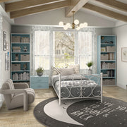 Right facing durable modern three-shelf light blue storage bookcase in a larger modular configuration in a room with accessories