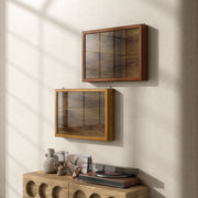 Left facing contemporary hanging golden oak finish wood photo frame sliding cabinet in a room with accessories