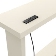 Left facing close up view of the charging panel on a contemporary soft white rectangular console on a white background