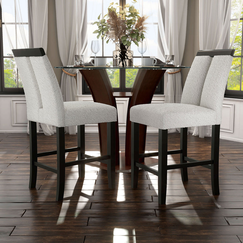 Angled set of two contemporary black with white boucle counter height stools in a room with accessories