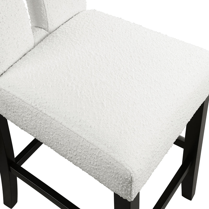 Right facing close up single view of a set of two contemporary black with white boucle counter height stools on a white background