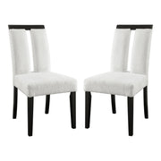 Angled set of two contemporary black with white boucle dining side chairs on a white background