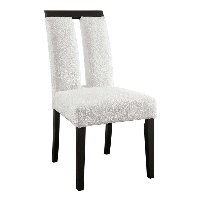 Right facing single view of a set of two contemporary black with white boucle dining side chairs on a white background