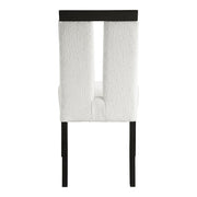 Front facing single back view of a set of two contemporary black with white boucle dining side chairs on a white background