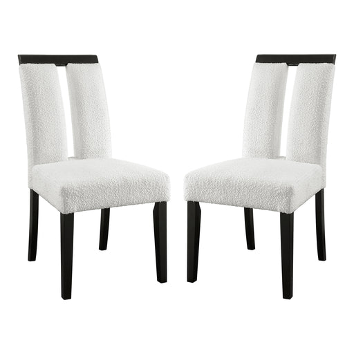 Angled set of two contemporary black with white boucle dining side chairs on a white background
