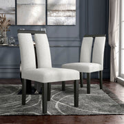 Angled set of two contemporary black with white boucle dining side chairs in a room with accessories