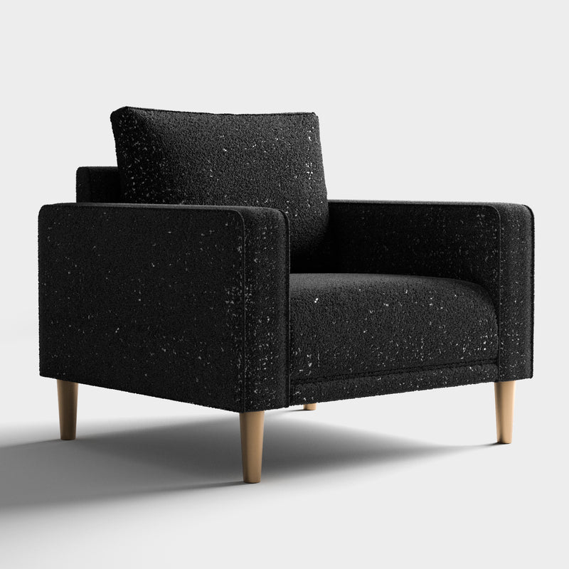 Right facing contemporary black and metallic boucle accent armchair on a white background