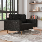 Right facing contemporary black and metallic boucle loveseat in a room with accessories